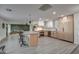 Modern kitchen with light wood cabinets, stainless steel appliances, and a large island at 8349 E Columbus Ave, Scottsdale, AZ 85251