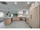 Modern kitchen with light wood cabinets, stainless steel appliances, and an island at 8349 E Columbus Ave, Scottsdale, AZ 85251