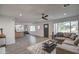 Open living room with L-shaped sofa and view into kitchen at 8349 E Columbus Ave, Scottsdale, AZ 85251