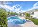 Inviting kidney-shaped pool with a spacious patio and lush landscaping at 8349 E Columbus Ave, Scottsdale, AZ 85251