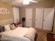 Main bedroom with double closets and ceiling fan at 9333 E University Dr # 196, Mesa, AZ 85207