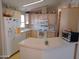 Well-equipped kitchen with white cabinets and appliances at 9333 E University Dr # 196, Mesa, AZ 85207