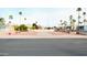 Neat and orderly community setting with trimmed bushes, benches, and palm trees at 9333 E University Dr # 196, Mesa, AZ 85207