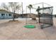 Community golf practice area with netting, tee, and artificial turf at 9333 E University Dr # 196, Mesa, AZ 85207