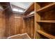 Large walk-in closet with shelves and hanging rods at 977 S Oxide Dr # 977, Apache Junction, AZ 85119