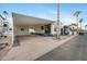 Mobile home exterior with carport and landscaping at 977 S Oxide Dr # 977, Apache Junction, AZ 85119