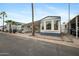 Mobile home exterior with carport and surrounding homes at 977 S Oxide Dr # 977, Apache Junction, AZ 85119