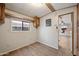 Kitchen with wood cabinets and view into living room at 977 S Oxide Dr # 977, Apache Junction, AZ 85119