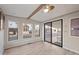 Bright living room with large windows and wood-look flooring at 977 S Oxide Dr # 977, Apache Junction, AZ 85119