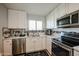 Well-equipped kitchen with stainless steel appliances at 10013 W Lakeview N Cir, Sun City, AZ 85351