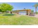 Side view of house with lush lawn and trees at 10317 W Corte Del Sol Este --, Sun City, AZ 85351