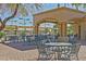 Outdoor patio with tables and chairs near bocce ball at 15433 W Cheery Lynn Rd, Goodyear, AZ 85395