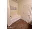 Bathroom with a large soaking tub at 15936 W Canterbury Dr, Surprise, AZ 85379