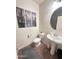 Clean bathroom with pedestal sink and toilet at 15936 W Canterbury Dr, Surprise, AZ 85379