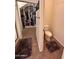 Small bathroom with toilet and walk-in closet at 15936 W Canterbury Dr, Surprise, AZ 85379