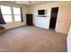 Spacious bedroom with carpet, large windows, and ample closet space at 15936 W Canterbury Dr, Surprise, AZ 85379