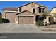 Two-story house with a three-car garage and attractive curb appeal at 15936 W Canterbury Dr, Surprise, AZ 85379