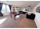 Game room with pool table, comfortable seating, and large windows at 15936 W Canterbury Dr, Surprise, AZ 85379