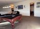 Game room with pool table and adjacent closet storage at 15936 W Canterbury Dr, Surprise, AZ 85379