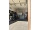 Well-lit garage with car lift and various storage options at 15936 W Canterbury Dr, Surprise, AZ 85379