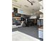 Large garage featuring a car lift and wall storage at 15936 W Canterbury Dr, Surprise, AZ 85379