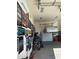 Garage with car lift and plenty of wall storage at 15936 W Canterbury Dr, Surprise, AZ 85379