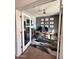 Bright home office features built-in desk and cabinets at 15936 W Canterbury Dr, Surprise, AZ 85379