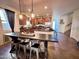 Island kitchen with granite counters and breakfast bar at 15936 W Canterbury Dr, Surprise, AZ 85379
