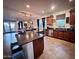 Modern kitchen with an island and stainless steel appliances at 15936 W Canterbury Dr, Surprise, AZ 85379