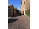 Gravel side yard with gates and a storage area at 15936 W Canterbury Dr, Surprise, AZ 85379