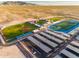 Aerial view of a high school with athletic fields and solar panels at 17765 W Summit Dr, Goodyear, AZ 85338
