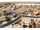 Aerial view showing a house's location in a community with a lake at 17765 W Summit Dr, Goodyear, AZ 85338