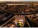 Stunning aerial view of a home with a pool and lake views at 17765 W Summit Dr, Goodyear, AZ 85338