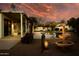 Backyard featuring a fountain, palm trees, and desert landscaping at 17765 W Summit Dr, Goodyear, AZ 85338
