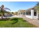 Expansive backyard with a refreshing pool and lush grass at 17765 W Summit Dr, Goodyear, AZ 85338