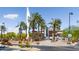Entrance to Goodyear Ballpark, featuring palm trees and team signage at 17765 W Summit Dr, Goodyear, AZ 85338