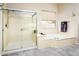 Spa-like bathroom with soaking tub and walk-in shower at 17765 W Summit Dr, Goodyear, AZ 85338