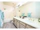 Elegant bathroom with dual sinks and large mirror at 17765 W Summit Dr, Goodyear, AZ 85338