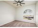 Charming bedroom with an arched window and ceiling fan at 17765 W Summit Dr, Goodyear, AZ 85338