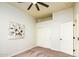 Bright bedroom with double closets and ceiling fan at 17765 W Summit Dr, Goodyear, AZ 85338