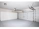 Garage with overhead storage and epoxy floor at 17765 W Summit Dr, Goodyear, AZ 85338