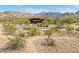 Desert landscape with a hiking trail leading towards distant mountains at 17765 W Summit Dr, Goodyear, AZ 85338