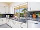 Granite countertops, stainless steel appliances, and a view of the backyard pool at 17765 W Summit Dr, Goodyear, AZ 85338