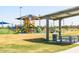 Modern playground with covered picnic area and play structures at 17765 W Summit Dr, Goodyear, AZ 85338