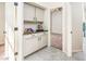 Convenient wet bar with granite countertop and cabinets at 17765 W Summit Dr, Goodyear, AZ 85338