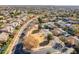 Aerial view of a quiet residential neighborhood with a park at 18526 E Swan Dr, Queen Creek, AZ 85142
