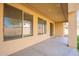Covered patio with multiple windows overlooking the backyard at 18526 E Swan Dr, Queen Creek, AZ 85142