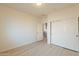 Bedroom with sliding door closet and access to hallway at 18526 E Swan Dr, Queen Creek, AZ 85142