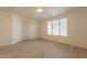 Bright bedroom with wood-look floors and large window at 18526 E Swan Dr, Queen Creek, AZ 85142