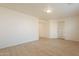 Bedroom with wood-look floors and a door to exterior at 18526 E Swan Dr, Queen Creek, AZ 85142